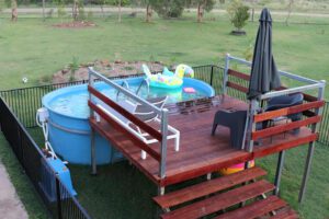 Schooner above-ground pool in acre yard.