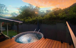 Above Ground Pool with water sparkling in the afternoon sunset.